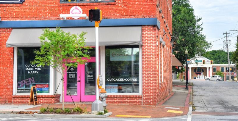 Kupcakerie, a Black-owned cupcake shop in downtown East Point, is close to City Hall and the East Point MARTA station. “We didn’t have access to any institutional capital or investors, parents. We had to save up the little crumbs and open with as little as we could,” co-owner Kascha Adeleye says. “We knew we had to get the capital ourselves.” CONTRIBUTED BY CHRIS HUNT PHOTOGRAPHY