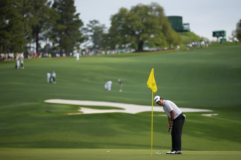 Hideki Matsuyama, of Japan, putts on the 11th hole during a practice round in preparation for the Masters golf tournament at Augusta National Golf Club Wednesday, April 10, 2024, in Augusta, GA. (AP Photo/Matt Slocum)