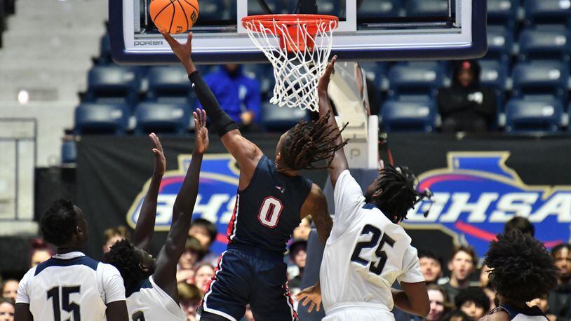 March 12, 2022 Macon - Berkmar's Jameel Rideout (0) goes up for the shot past Norcross' Mier Panoam (3) and Norcross' Hezekiah Flagg (25) during the 2022 GHSA State Basketball Class AAAAAAA Boys Championship game at the Macon Centreplex in Macon on Saturday, March 12, 2022. (Hyosub Shin / Hyosub.Shin@ajc.com)