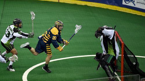 Georgia Swarm forward Jordan Hall scores in the first half against Saskatchewan in Sunday’s first game of the National Lacrosse League finals in the Infinite Energy Arena. The Swarm won 18-14 in the best-of-three series. (PHOTO CREDIT: Paul Sasso, MV Photo Concepts)