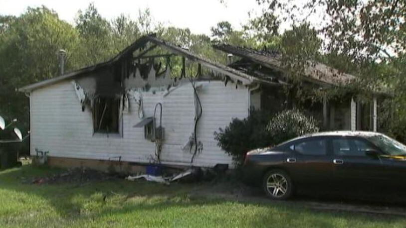 Neighbors told WSOC-TV that a South Carolina woman died Saturday morning when she attempted to run back inside a burning house to save her children.