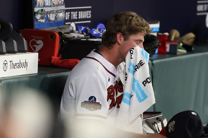 Atlanta Braves starting pitcher Bryce Elder (55) rests in the dugout after being pulled from the game. Miguel Martinez/miguel.martinezjimenez@ajc.com
