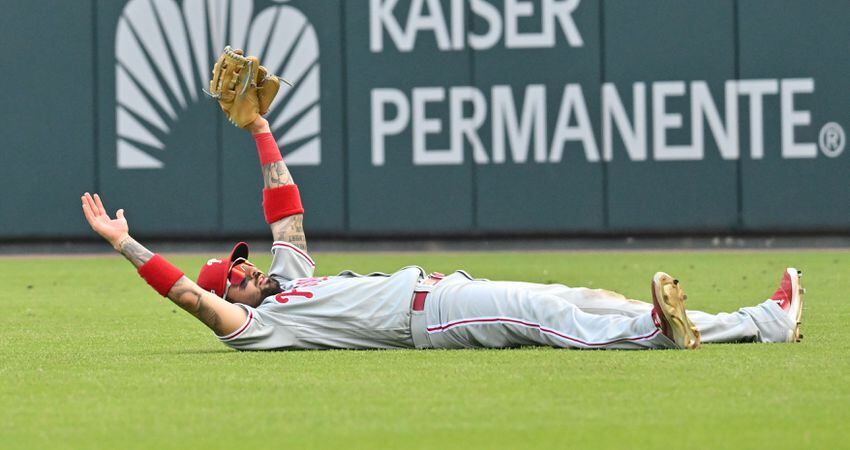 Phillies' Nick Castellanos reacts after his diving catch of William Contreras' line drive during the ninth inning of game one of the baseball playoff series between the Braves and the Phillies at Truist Park in Atlanta on Tuesday, October 11, 2022. (Hyosub Shin / Hyosub.Shin@ajc.com)