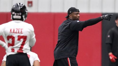 Atlanta Falcons defensive coordinator Marquand Manuel directs the defense during organized team activities Tuesday, May 22, 2018, in Flowery Branch.
