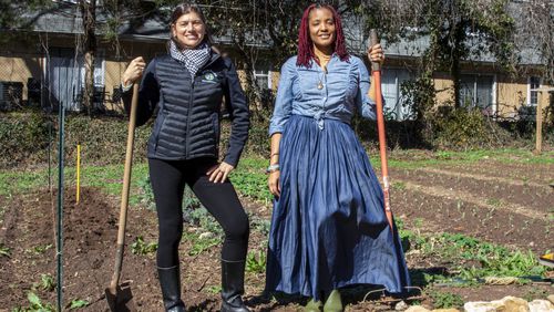 Leslie Zinn (left), CEO of Arden's Garden, and Yennenga Adanya, founder of Oyun Botanical Gardens, partnered to keep the urban farm located in East Point from being purchased and redeveloped. (Courtesy of Arden's Garden)