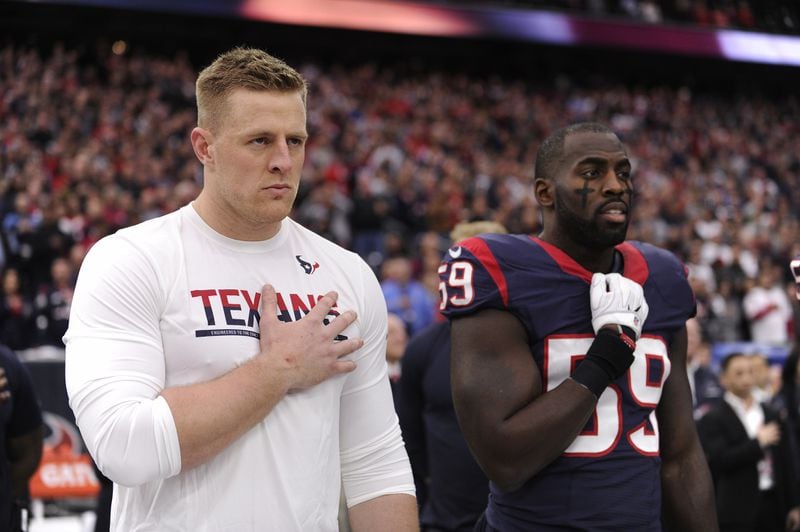  Houston Texans J.J. Watt, left, and Houston Texans outside linebacker Whitney Mercilus (59) stands on the sidelines during anthem before the first half of an AFC Wild Card NFL game between the Houston Texans and the Oakland Raiders, Saturday, Jan. 7, 2017, in Houston. (AP Photo/Eric Christian Smith)