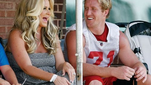 061912 FLOWERY BRANCH: Atlanta Falcons defensive end Kroy Biermann shares a laugh with his wife Kim Zolciak at the end of team practice on the first day of mini-camp in Flowery Branch on Tuesday, June 19, 2012. CURTIS COMPTON / CCOMPTON@AJC.COM 061912 FLOWERY BRANCH: Atlanta Falcons defensive end Kroy Biermann shares a laugh with his wife Kim Zolciak at the end of team practice on the first day of mini-camp in Flowery Branch on Tuesday, June 19, 2012. He never turned into a reality football star. CURTIS COMPTON / CCOMPTON@AJC.COM