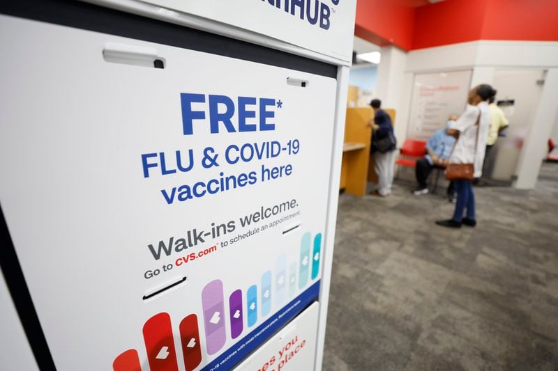 A COVID-19 sign is seen inside the CVS at North Decatur on Wednesday, Sept. 13. 2023. On Monday, the Food and Drug Administration approved the revised vaccines, anticipating their arrival shortly after a surge in COVID cases during the summer and just before the onset of flu season.

Miguel Martinez /miguel.martinezjimenez@ajc.com