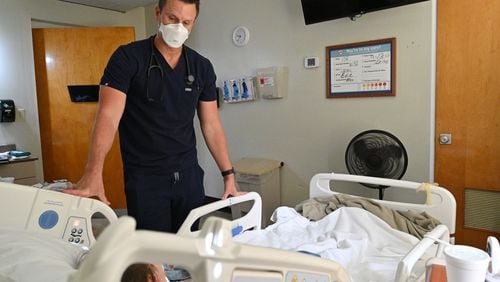 In this file photo, Dr. Jason Laney checks a patient recovering from COVID-19 at Jeff Davis Hospital in Hazlehurst (Hyosub Shin / Hyosub.Shin@ajc.com)