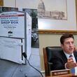 Bryan Steil, R-Wis., chairman of the Committee on House Administration, displays a large photo of an unlocked election ballot drop box in Washington, during a hearing about noncitizen voting in U.S. elections. on Capitol Hill, Thursday, May 16, 2024 in Washington. In recent months, the specter of noncitizens voting in the U.S. has erupted into a leading rallying cry for Republicans. (AP Photo/John McDonnell)