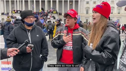 Nolan Harold Kidd (center) and Savannah Danielle McDonald (right) are seen in an interview with an independent journalist outside the U.S. Capitol, Jan. 6, 2021. Kidd and McDonald were arrested by the FBI June 11, 2021, in connection with the insurrection. Credit: YouTube