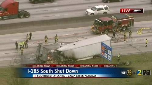 All southbound lanes are blocked on I-285 in Fulton County on Friday afternoon after a tractor-trailer caught fire.