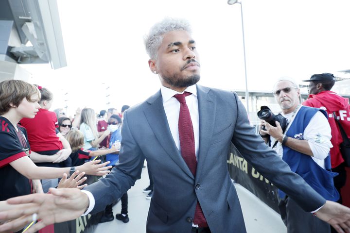 Atlanta United forward Josef Martinez high five supporters during the team walk as the team arrives at the Mercedes-Benz Stadium before the game against the Columbus Crew on Saturday, May 28, 2022.