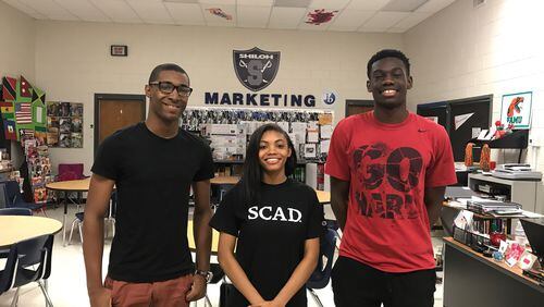 Shiloh High School seniors De'Onta Alston, Ayanna Gash and Isreal Koker-Thomas are among the first class of students to complete its International Baccalaureate Career-Related Programme. ERIC STIRGUS / ESTIRGUS@AJC.COM