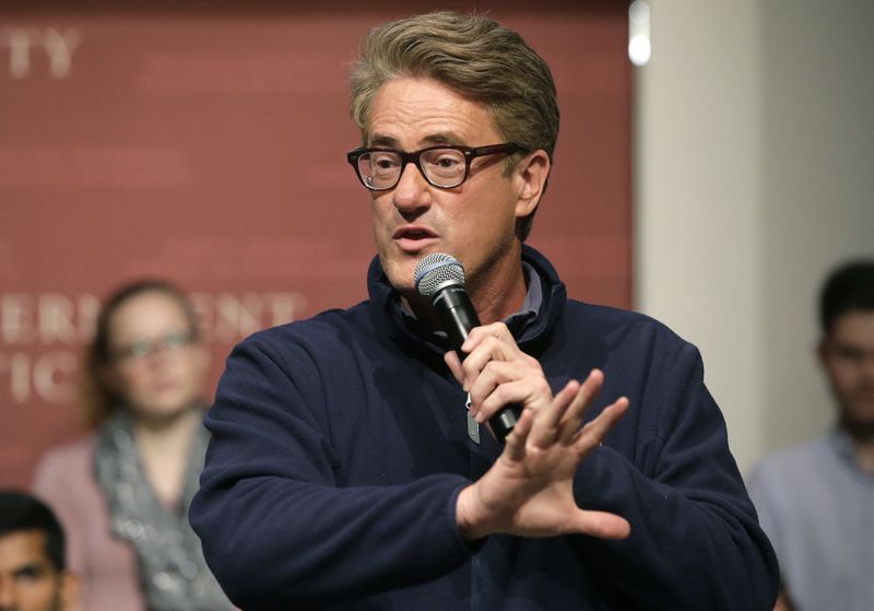 FILE - MSNBC television anchor Joe Scarborough, co-hosts of the show "Morning Joe," takes questions from an audience, Wednesday, Oct. 11, 2017, at a forum called, "Harvard Students Speak Up: A Town Hall on Politics and Public Service," on the campus of Harvard University, in Cambridge, Mass. In the past few weeks, NBC reversed a decision to hire former Republican National Committee head Ronna McDaniel as a political contributor following a revolt by some of its best-known personalities, including Scarborough, Rachel Maddow, and others. (AP Photo/Steven Senne, File)