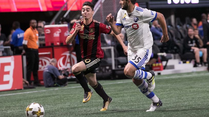 Atlanta United midfielder Miguel Almiron (10) pushes the ball past Montreal Impact defender Deian Boldor (35) during the first half of a MLS soccer game at Mercedes-Benz Stadium, Sunday, Sept. 24, 2017, in Atlanta.  BRANDEN CAMP/SPECIAL