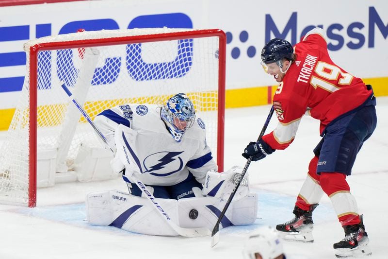 Florida Panthers left wing Matthew Tkachuk (19) attempts a shot at Tampa Bay Lightning goaltender Andrei Vasilevskiy (88) during the first period of Game 1 of the first-round of an NHL Stanley Cup Playoff series, Sunday, April 21, 2024, in Sunrise, Fla. (AP Photo/Wilfredo Lee)
