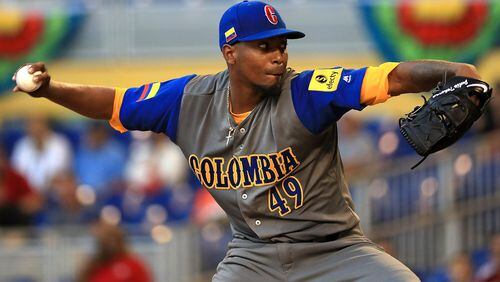 The Braves’ Julio Teheran delivers one of his 61 pitches for Colombia in a winning WBC performance against Canada. (Mike Ehrmann/Getty Images)
