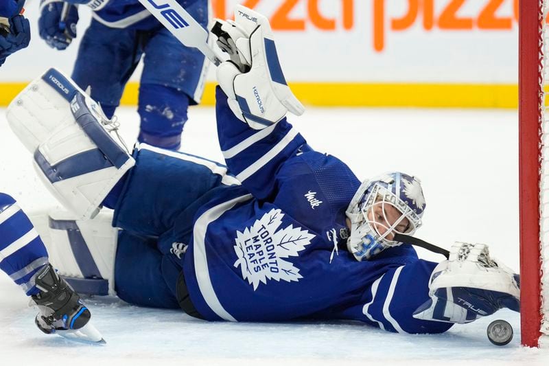 Toronto Maple Leafs goaltender Ilya Samsonov (35) reaches back to make a save against the Florida Panthers during the first period of an NHL hockey game in Toronto on Monday, April 1, 2024. (Frank Gunn/The Canadian Press via AP)