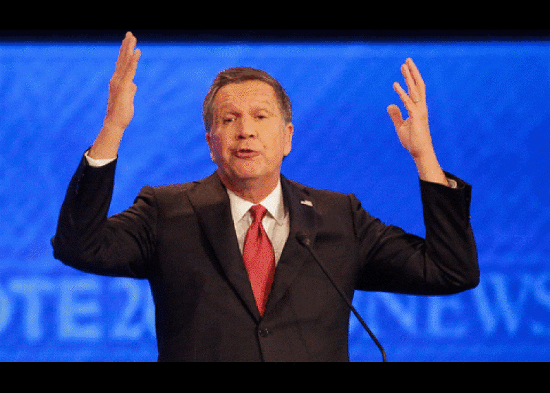 John Kasich, who likes to put his hands in the air, isn't going anywhere.