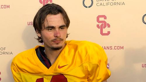 Southern California quarterback J.T. Daniels listens to reporters following his first practice after winning the Trojans' starting job, Tuesday, Aug. 28, 2018, in Los Angeles.