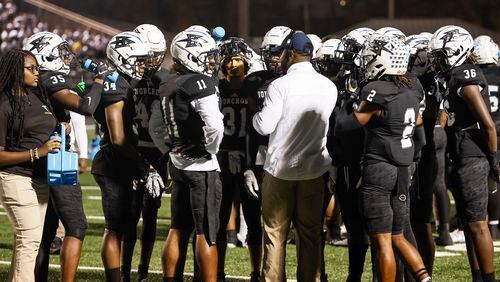 Norcross High football players huddle during the first half of their matchup against North Gwinnett on Friday, November 3, 2022. (Natrice Miller/natrice.miller@ajc.com)  