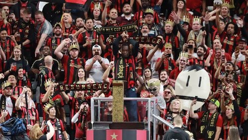 October 30, 2019 Atlanta: Former Atlanta Hawks star Dikembe Mutombo hammers the golden spike to help open the match between Atlanta United and Toronto FC in the Eastern Conference Final on Wednesday, October 30, 2019, in Atlanta.   Curtis Compton/ccompton@ajc.com