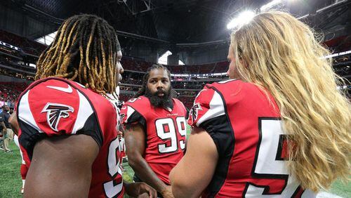 August 31, 2017 Atlanta: Falcons Takkarist McKinley (from left), Adrian Clayborn, and Brooks Reed confer on the sidelines against the Jaguars in a NFL preseason football game on Thursday, August 31, 2017, in Atlanta.    Curtis Compton/ccompton@ajc.com