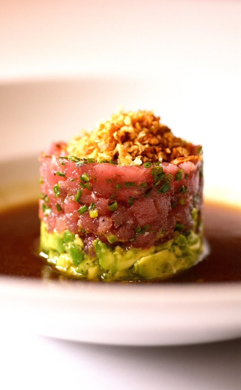 C&amp;S tuna tartar with baked avocado, crispy shallots, soy mirin sauce and crispy chips. CONTRIBUTED BY: Green Olive Media.