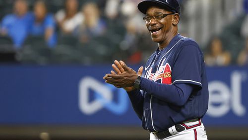Atlanta Braves third base coach Ron Washington reacts after Braves' William Contreras hit a solo home run against the Texas Rangers during the fourth inning of a baseball game Friday, April 29, 2022, in Arlington, Texas. (AP Photo/Ron Jenkins)