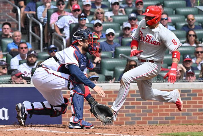 Philadelphia Phillies' Nick Castellanos scores on a hit by Jean Segura during the third inning of game one of the baseball playoff series between the Braves and the Phillies at Truist Park in Atlanta on Tuesday, October 11, 2022. (Hyosub Shin / Hyosub.Shin@ajc.com)