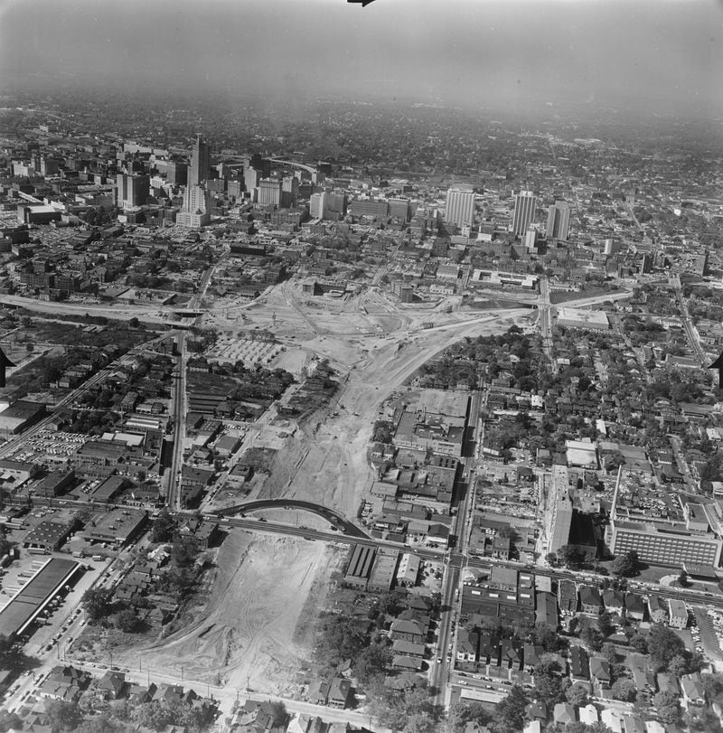 This aerial photo taken on Oct. 18, 1962, facing west, shows the creation of the interchange between the Downtown Connector and what would become Freedom Parkway. the road at the center bottom is Boulevard. One block to the west is Jackson Street, before the bridge was built there. The new freeway, which went be several names (The Northeast Expressway, the Stone Mountain Freeway and I-485), was fought by neighbors for decades before being scaled back and becoming today's Freedom Parkway. Credit: Kenan Research Center, at the Atlanta History Center (Jack Etheridge Photograph Collection).