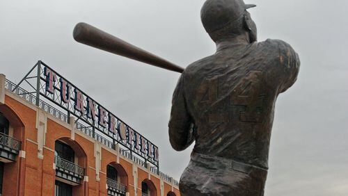 The Hank Aaron statue at Turner Field is at the center of a dispute between the city and the Atlanta Braves. AJC File