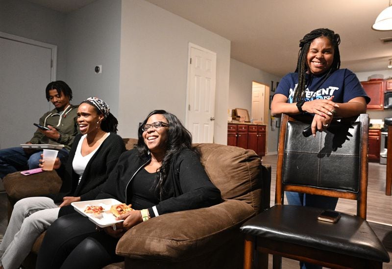 Teachers at James A. Jackson Elementary School (from left) Alvin Glymph, Gerlisa Shipman, Quajaulon Williams and Melanie Lange, react as they watch the sitcom “Abbott Elementary” at the home of Melanie Lange, Friday, Jan. 20, 2023, in College Park. Melanie Lange is holding a viewing party for "Abbott Elementary," a sitcom about a Philadelphia school. The popular show is a particular hit with educators, who see themselves and colleagues in the over-the-top antics of the sitcom's characters. (Hyosub Shin / Hyosub.Shin@ajc.com)