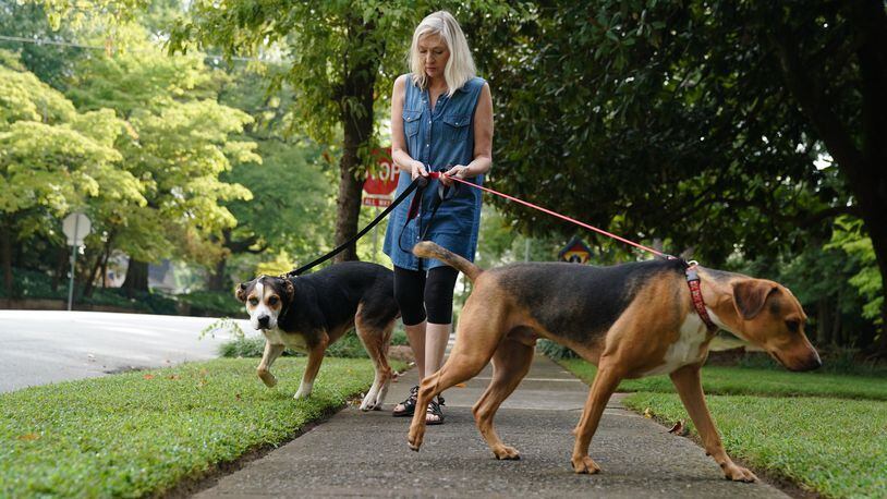 Jean Allred walks her dogs Jack and Molly recently in Marietta. Allred has a plan and money set aside for the care of her two dogs and two cats in her will. ELIJAH NOUVELAGE / FOR THE ATLANTA JOURNAL CONSTITUTION