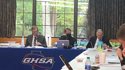 (L-R) GHSA president Glenn White, executive director Robin Hines and attorney Alan Connell listen to arguments at the Valdosta appeal before the GHSA board of trustees.