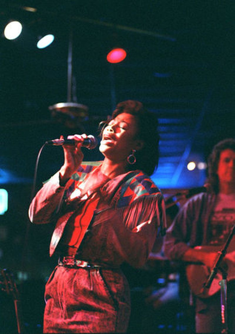 Maryline Blackburn performs a country song in 1997 at the Buckboad Country Music Showcase. (Jonathan Newton/AJC)