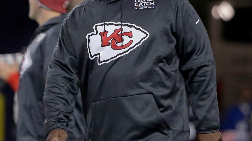 FILE - In this Oct. 14. 2018, file photo, Kansas City Chiefs offensive coordinator Eric Bieniemywalks on the field before the team's NFL football game against the New England Patriot, in Foxborough, Mass. It was Doug Pederson a couple years ago. Matt Nagy last year. Now, it's Eric Bieniemy that is juggling the roles of Chiefs offensive coordinator with the phone calls from teams searching for their next head coach. (AP Photo/Steven Senne, File)