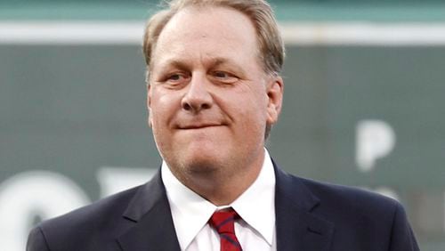 In this Aug. 3, 2012, file photo, former Boston Red Sox pitcher Curt Schilling looks on after being introduced as a new member of the Boston Red Sox Hall of Fame before a baseball game between the Red Sox and the Minnesota Twins at Fenway Park in Boston. Schilling is defending himself after making comments on social media about transgender people, saying he was expressing his opinion.