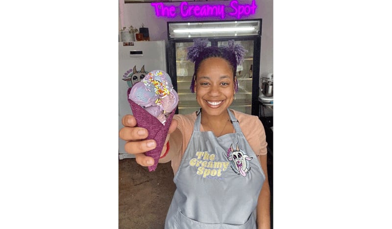 Wendy Golding, the founder of GOAP and the Creamy Spot, holds a plant-based ice cream cone at the Creamy Spot. / Courtesy of the Creamy Spot