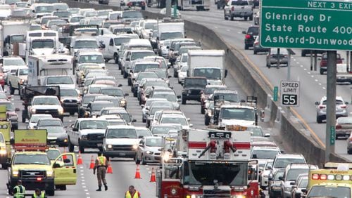 A traffic accident shuts down I-285 in Sandy Springs. The city has introduced three ways to keep commuters posted of emergency road closures. JOHN SPINK / JSPINK@AJC.COM