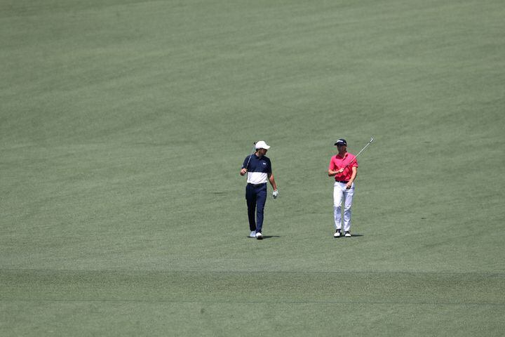 April 7, 2021, Augusta: Jordan Spieth, left, and Justin Thomas walk down the second fairway during their practice round for the Masters at Augusta National Golf Club on Wednesday, April 7, 2021, in Augusta. Curtis Compton/ccompton@ajc.com