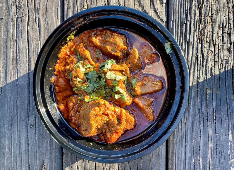 Olomi's Grill serves a spicy karahi that can be ordered with chicken or lamb (shown here with lamb). Wendell Brock for The Atlanta Journal-Constitution