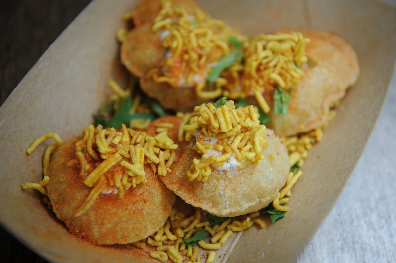 SPDP- puffed flour crisps (puris) stuffed with potatoes, onions, cilantro and chickpea noodles with sweet yogurt, green and tamarind chutney. (Beckysteinphotography.com)