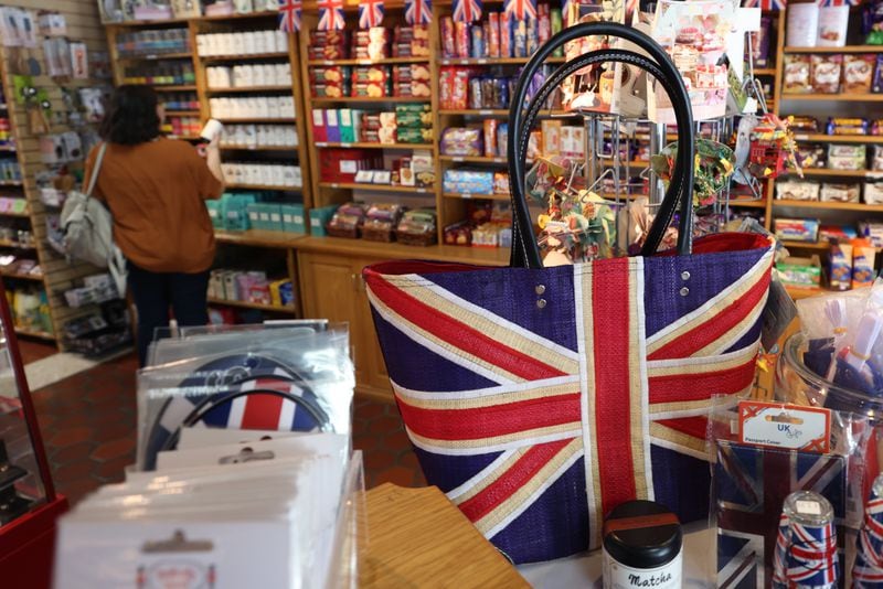 The Union Jack adorns many items at the Taste of Britain shop. In recent years, those who adored Queen Elizabeth have sometimes had to respond to critics of Great Britain’s colonial past. (Jason Getz / Jason.Getz@ajc.com)