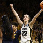Guard Caitlin Clark of the Iowa Hawkeyes celebrates as time runs out in the second half against the West Virginia Mountaineers during their second round match-up in the 2024 NCAA Division 1 Women's Basketball Championship at Carver-Hawkeye Arena on March 25, 2024, in Iowa City, Iowa. (Matthew Holst/Getty Images/TNS)