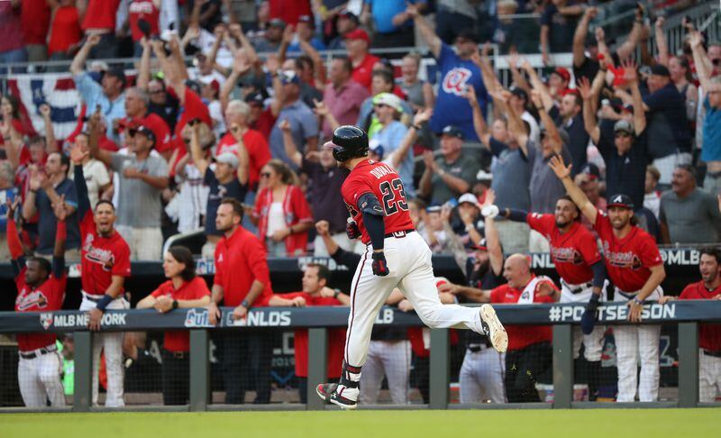 Braves left fielder Adam Duvall (23) reacts after hitting a two-run home run in the seventh inning.  (JASON GETZ/SPECIAL TO THE AJC)