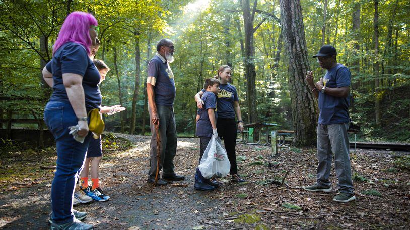 Hannah Palmer, center, led a group of neighbors on a cleanup of Utoy Creek as part of Atlanta Creek League, which invites residents to join their local creek “team” and compete for points by completing activities. Rodney Cofield Jr./Courtesy of Atlanta Creek League