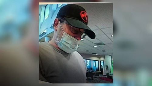 Mark Garniss, a Newnan man who shot and killed himself hours after robbing an Alabama bank Wednesday, is now linked to two similar robberies in Georgia.