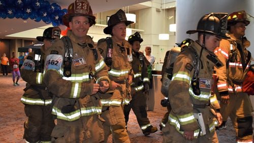 The firefighters wore their full gear during the climb to the top of the tallest hotel in the Southeast.